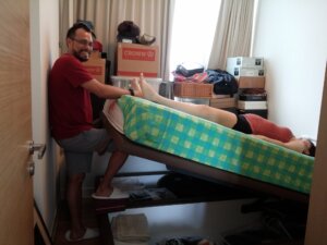 Dad's the hero in this "over the top" support to help his mate do a Breech Tilt in the comfort of bed!