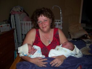 My dear Friend, Jeanne Bazille with one of her many sets of twins she welcomed into the world.